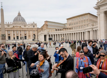 Citizens playing instruments in front of the Vatican